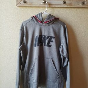 A gray therma-fit Nike hoodie